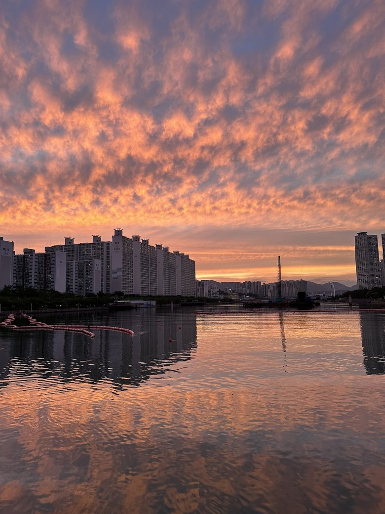 Red sunset clouds spreading over the sea