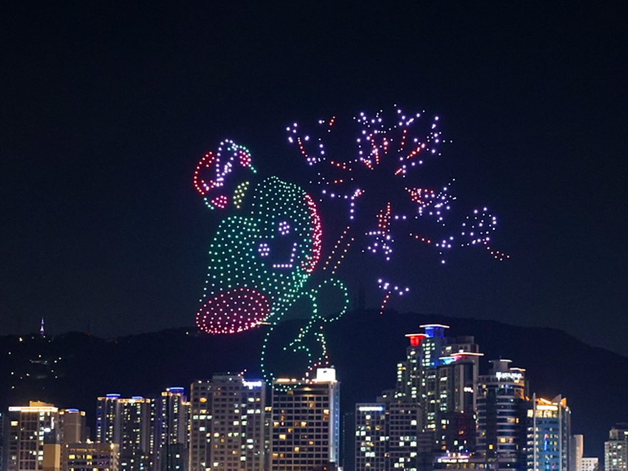 A dragon-shaped drone show rising above Gwangan Bridge