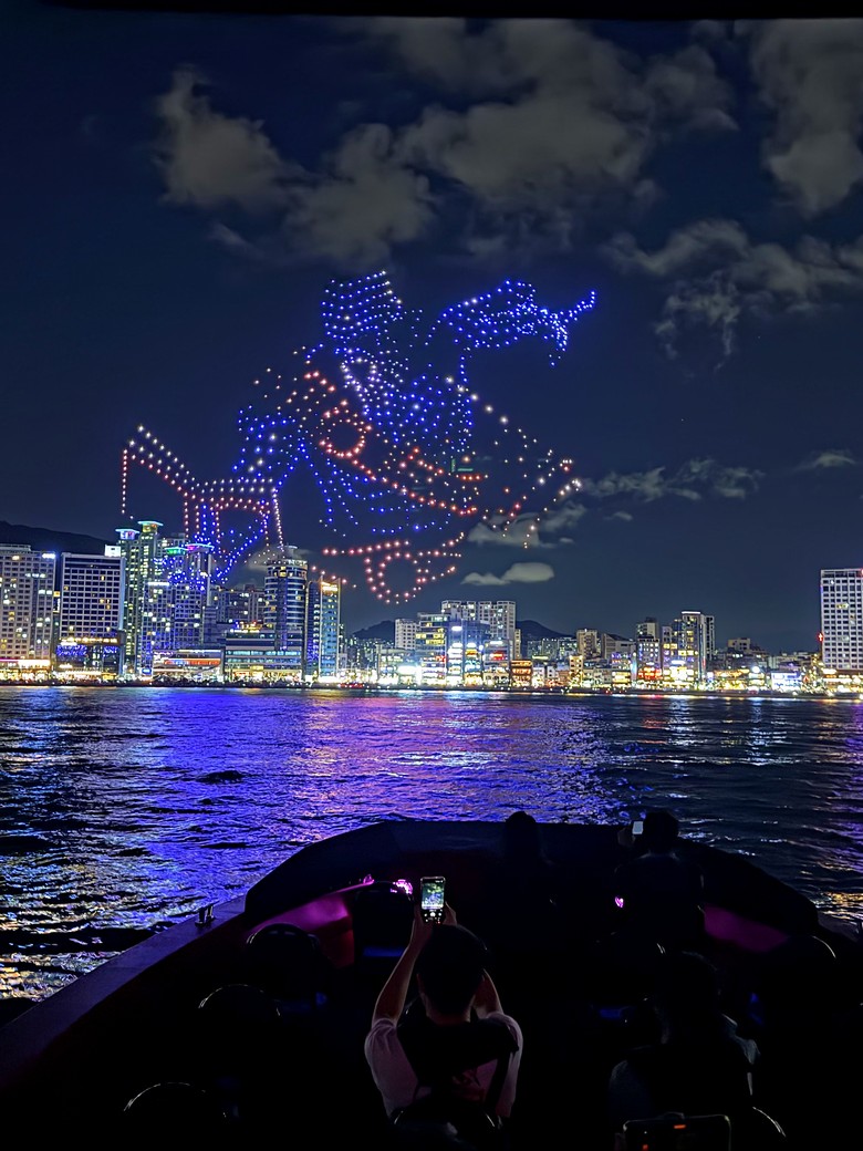 A dragon-shaped drone show seen from the bow