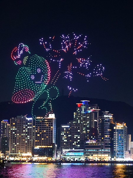 The night sky with the drone show and fireworks together