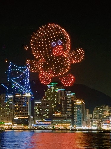 A drone character floating above the city
