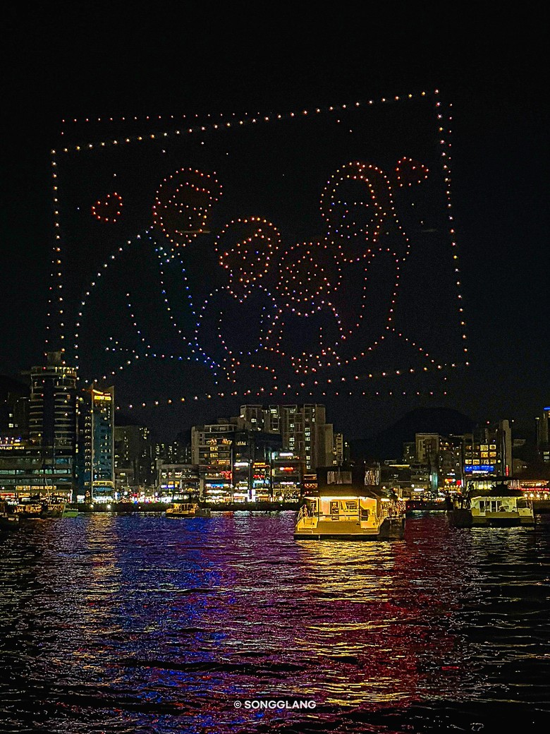 A figure in a frame drawn with drones