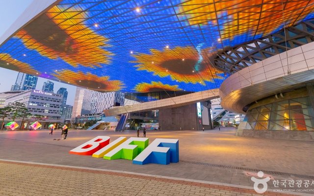 The huge roof of the Busan Cinema Center lit up
