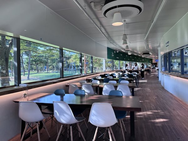 The passenger waiting room with tables and chairs