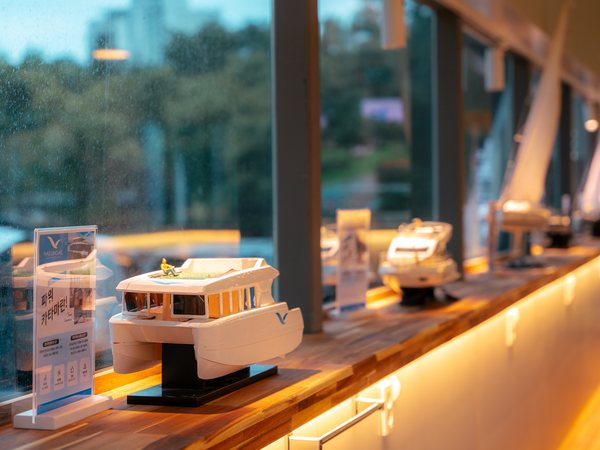 Shelves displaying model yachts