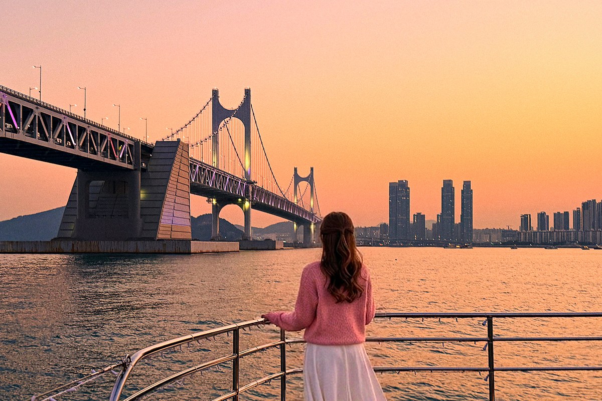 Sunset cruise sailing through the glow in front of Gwangan Bridge