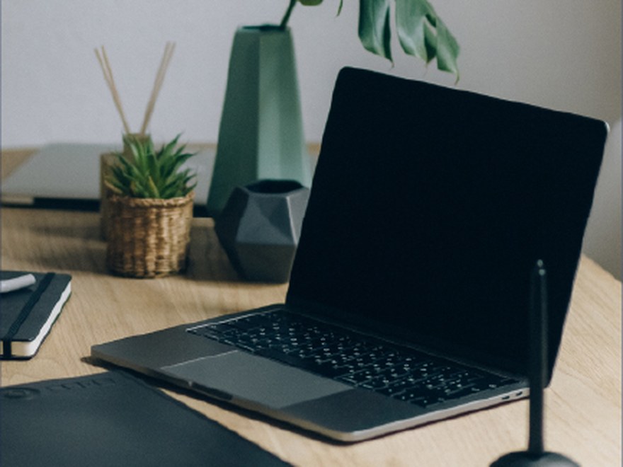 A laptop and pointer ready for the event