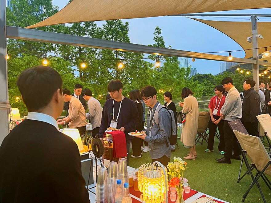 A 2F open-air rooftop event with the lights on