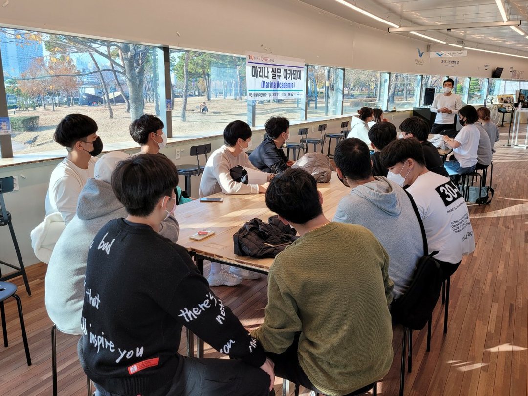 Attendees seated at the window bar