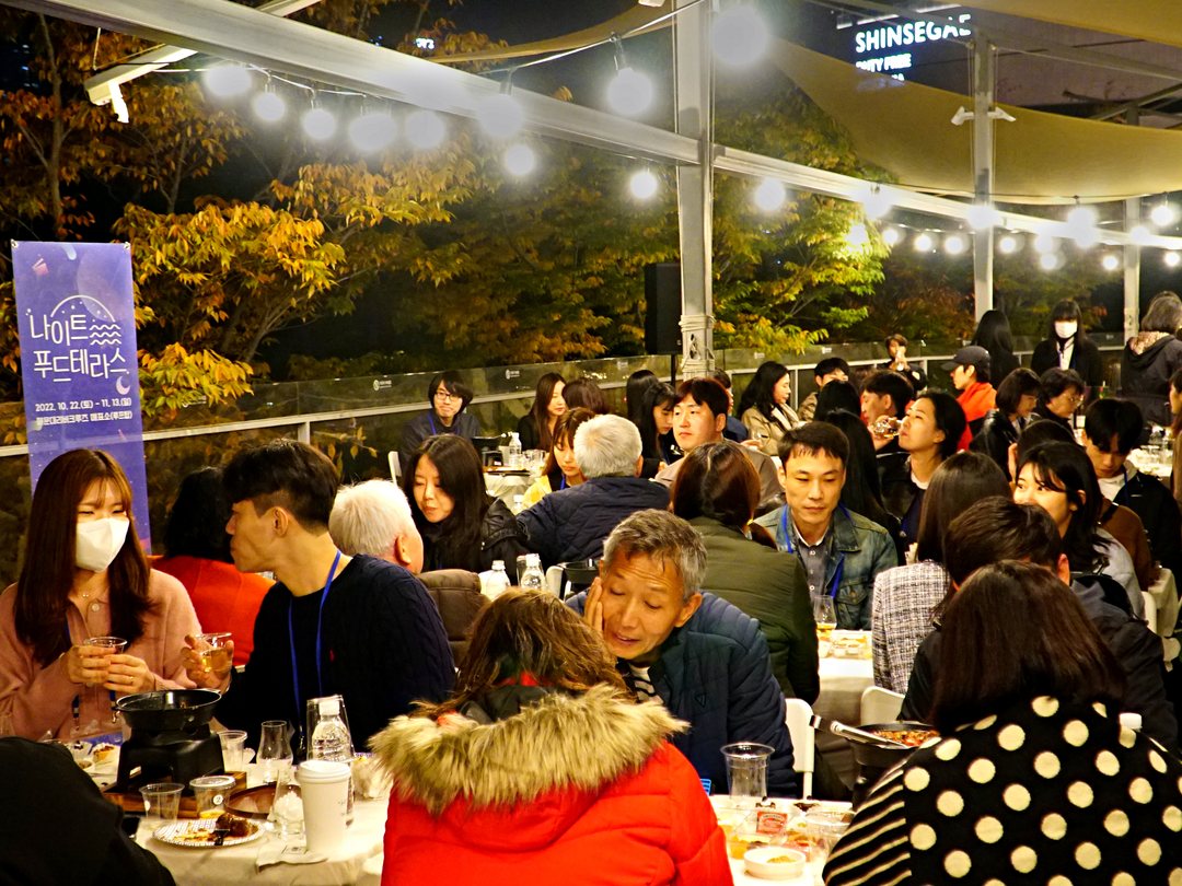 An evening indoor event with the lights on
