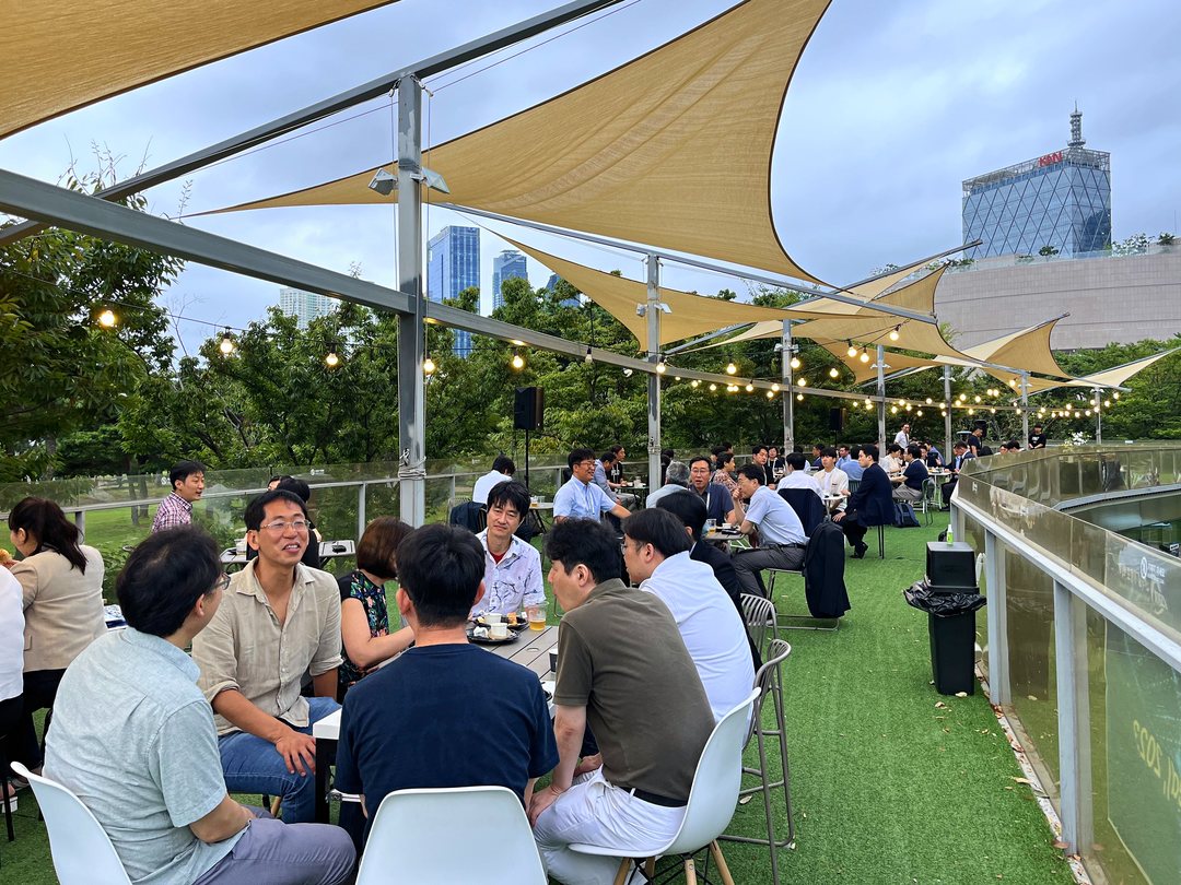 Open-air rooftop seats facing the park