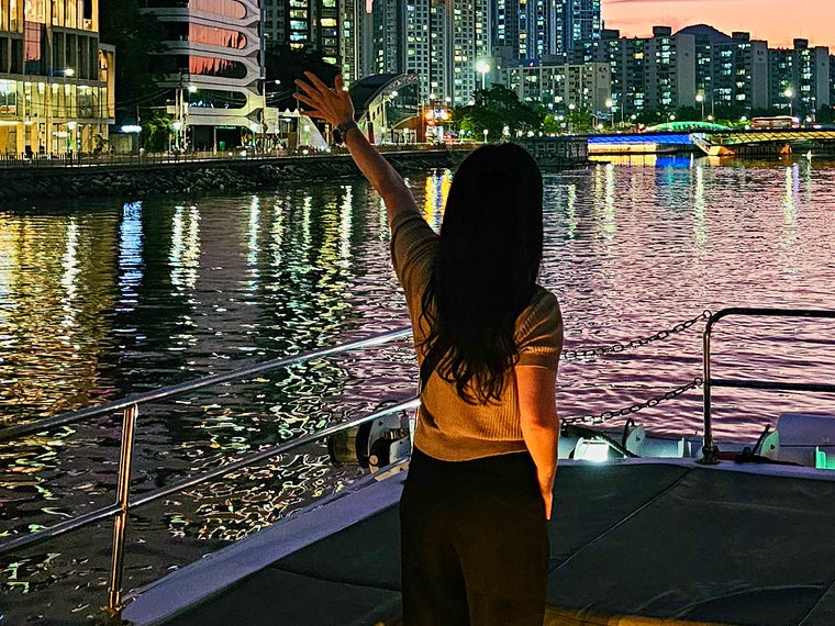 A guest on deck at sunset
